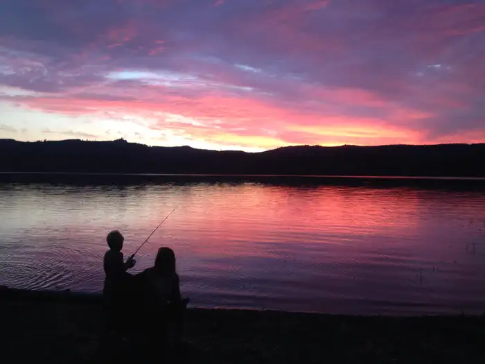 Deep purple and red sunset over the lake